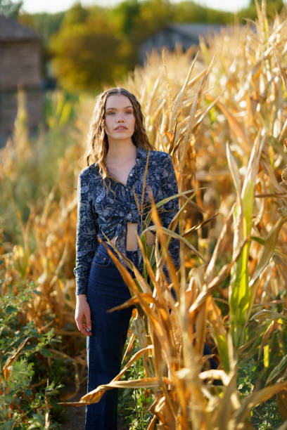 istock A Fashion Model is Posing Gracefully in a Beautiful Cornfield while Bathed in Natural Light 2185219608