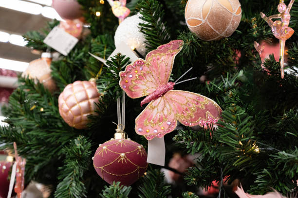 istock Decorative pink butterfly on a Christmas tree. 2185220791