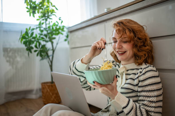 istock Student with laptop and noodles, preparing for the exam 2185220875
