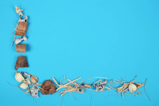Minimalist Composition of Red Potpourri on Blue Background in L-Shape Design – Creative and Colorful Arrangement for Seasonal or Aromatherapy Themes