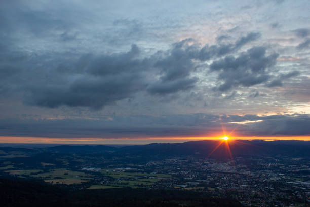 dawn against the backdrop of mountains and a small town