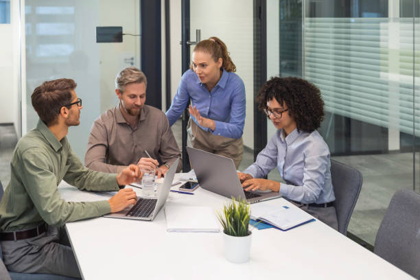 istock Business team discussing together business plans in office. 2185226383