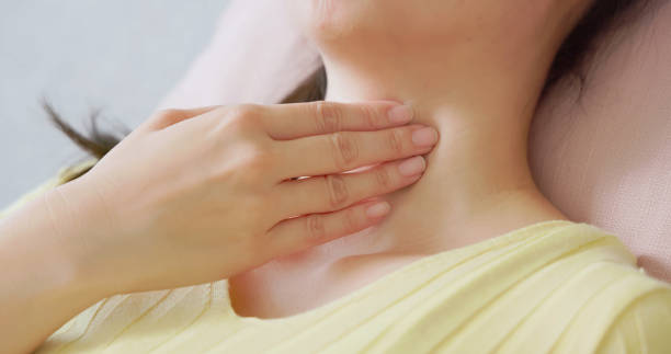 istock asian woman has sore throat 2185229206