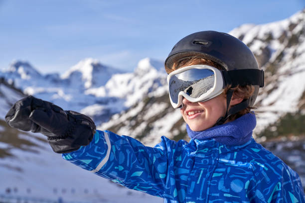 istock Boy pointing away on ski resort 2185229317