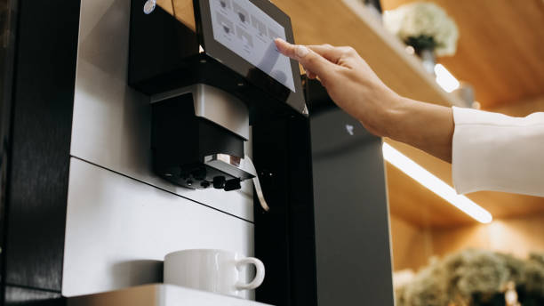 Close-up of preparing aromatic coffee in a professional coffee machine.