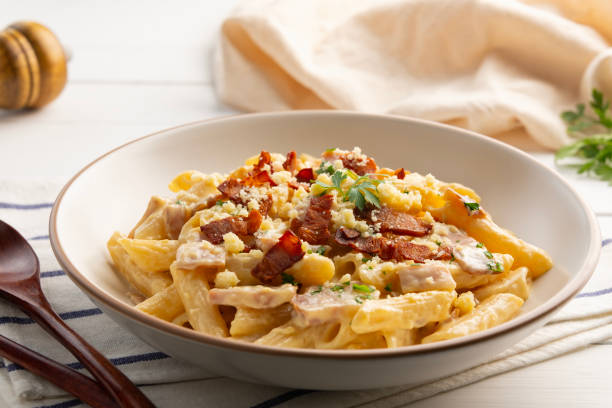 istock Creamy Penne Pasta Carbonara sauce bacon. 2185230376