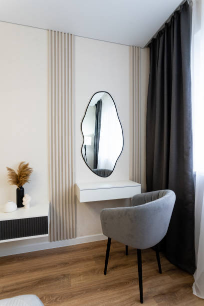 istock The Modern Minimalist Bedroom Interior features an Elegant Mirror and Cozy Seating Area for ultimate relaxation 2185236048