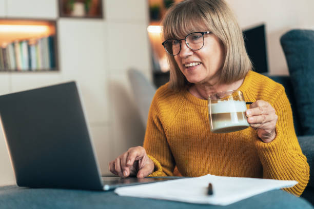 istock Senior woman having video call 2185236951