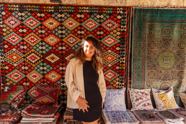 istock Woman portrait in front of an old authentic rug 2185238749