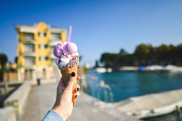 istock Eating delicious pink ice cream in cone 2185238847