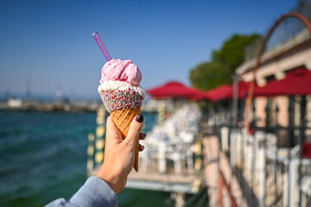 istock eating ice cream cone in vacation. 2185238854