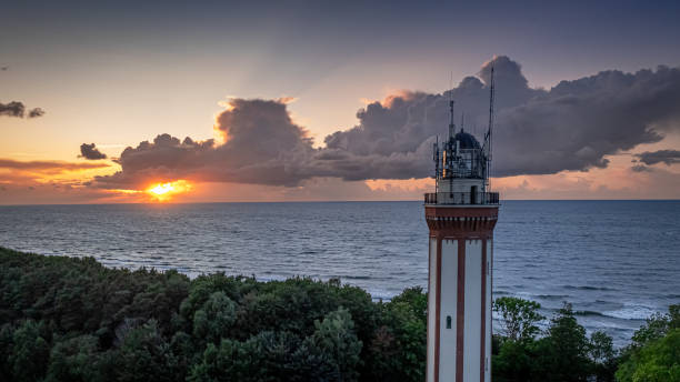 istock Aerial view of light beam from lighthouse at Baltic Sea 2185239202