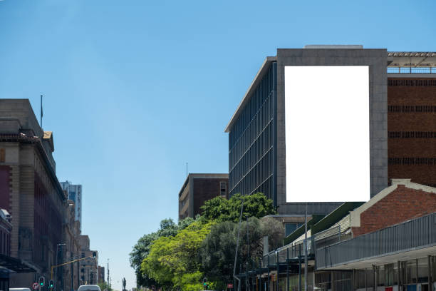 istock Blank empty billboard mockup template for advertising on a building facade. City center 2185240958