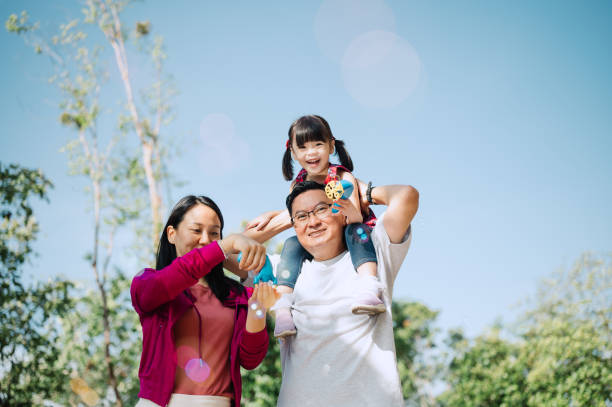 istock Asian Chinese family playing bubbles in public park 2185241702