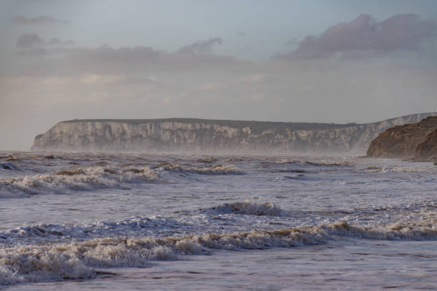Freshwater, England - August 20, 2016: Family caught out by big waves, during a freak summer storm