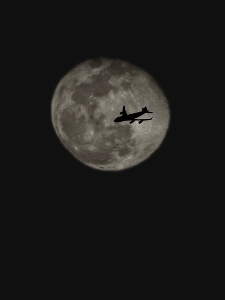 istock The full moon has the shadow of an airplane flying past. 2185242671