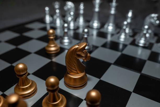 istock Chessboard with close up of chess game pieces 2185243018