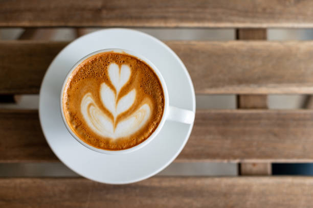 A cup of latte on wooden table
