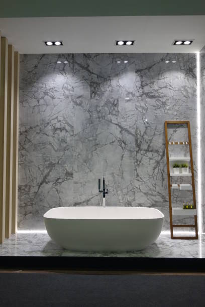 istock Modern Minimalist Bathroom with Freestanding Tub and Marble Accent Wall 2185247044
