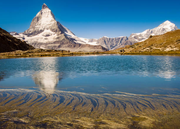 istock Majestic Matterhorn Mirrored in Serene Alpine Lake 2185249949