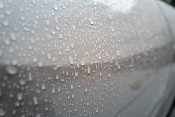 Valencia-Spain Sept. 02-2023. High angle view of a speeding car in a wet city street during rain storm