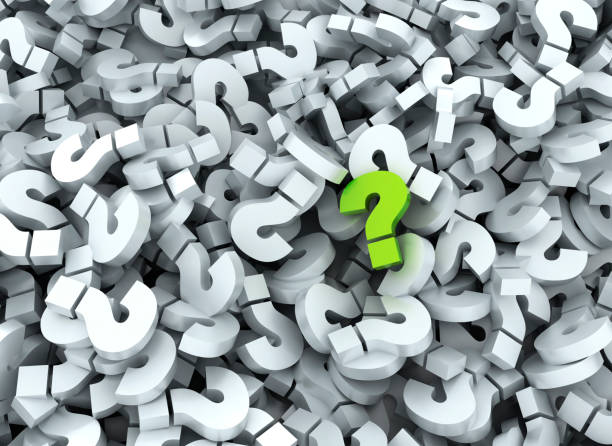 istock Green question mark standing out on a background of white signs 2185251550