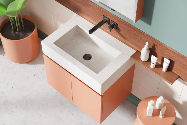 istock Top view of colored hotel bathroom interior with sink and accessories on vanity 2185251839