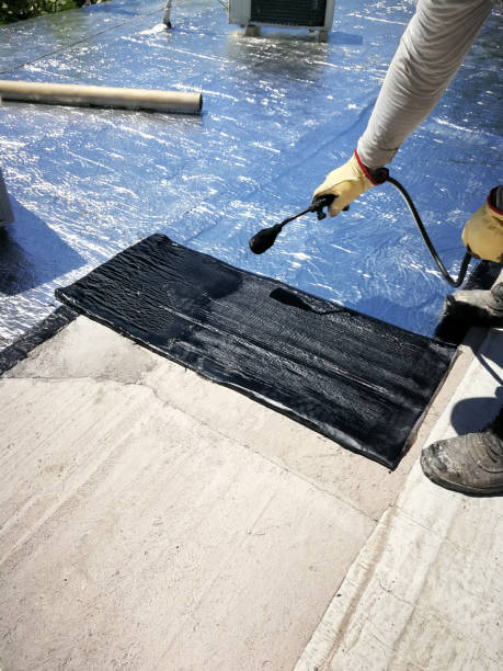 istock The roofer glues asphalt membrane with a blowtorch. 2185251996