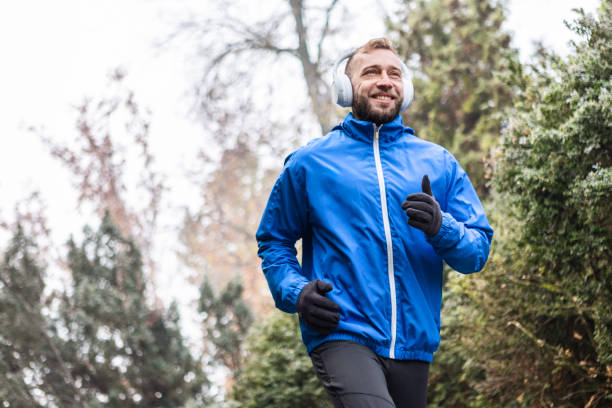 Headphones On, Runner in Motion Through the Fog
