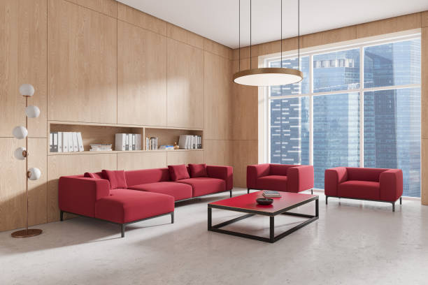 istock Office room interior with red sofa and armchairs, shelf and panoramic window 2185254060