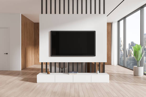 istock Luxury home living room interior with tv screen, shelf and panoramic window 2185254842