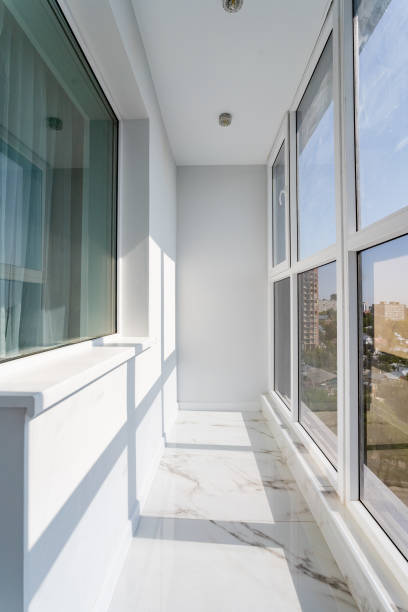 istock Imagine a charming balcony with elegant windows that let in abundant natural light, set on a stunning marble floor, creating a serene retreat for ultimate relaxation from daily hustle 2185255021