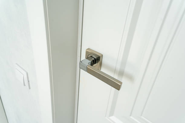 istock This image features a detailed closeup view of a door handle installed on a pristine white door, showcasing the design elements and materials used in this essential household fixture 2185255052