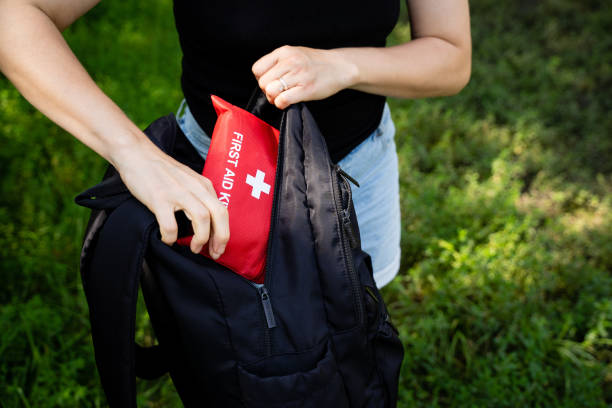istock A person is packing a wellprepared first aid kit into their backpack while enjoying the beauty of nature 2185255102