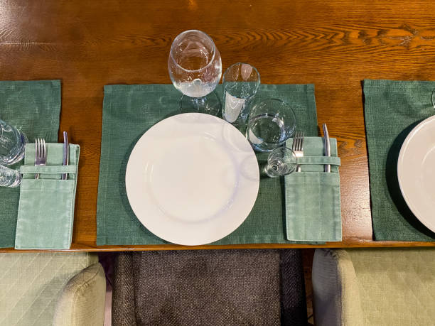 istock There is a table that is set with plates and glasses placed on it 2185255145