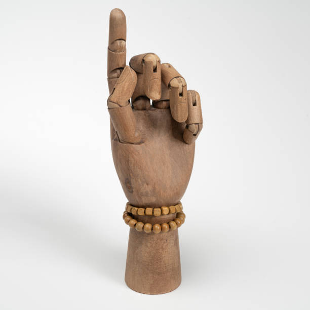 istock wooden hand with two wooden bracelets 2185256202