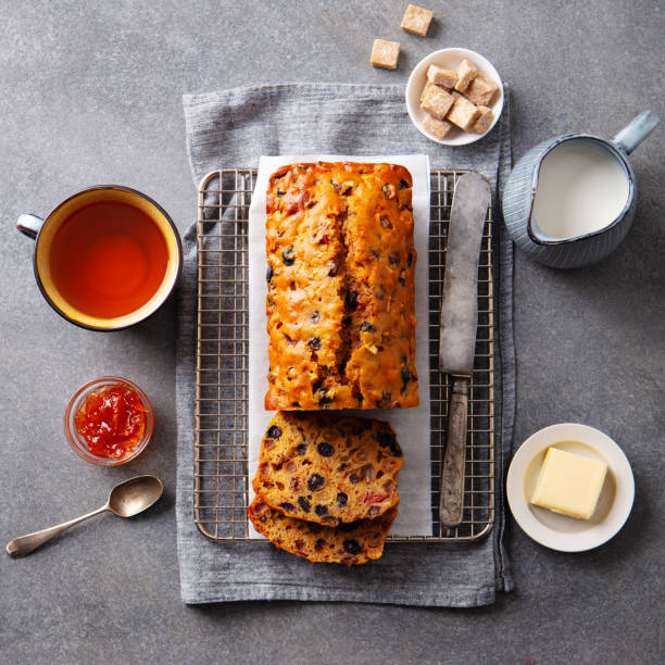 istock Fruit cake Bara Brith with cup of tea. Welsh traditional dessert. Grey background. Top view. 2185256319
