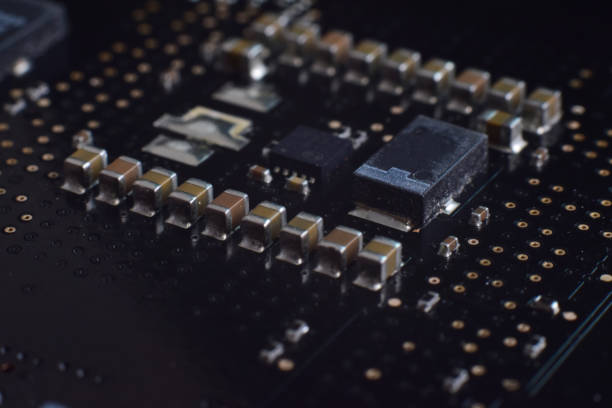 istock ICs and capacitors chip on motherboard 2185256523