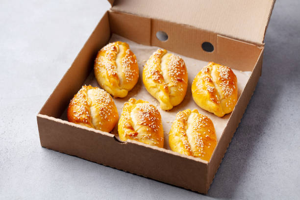 istock Sweet or savoury pies in a box. Grey background. Close up. 2185256571