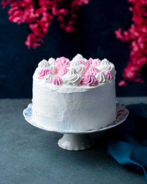istock Decorated cake with whipped cream and flowers. Grey, dark background. Copy space. 2185256699
