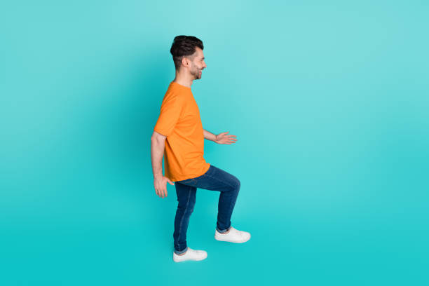 istock Profile side photo top angle view of guy worker climb up steps invisible staircase isolated on cyan color background 2185257893