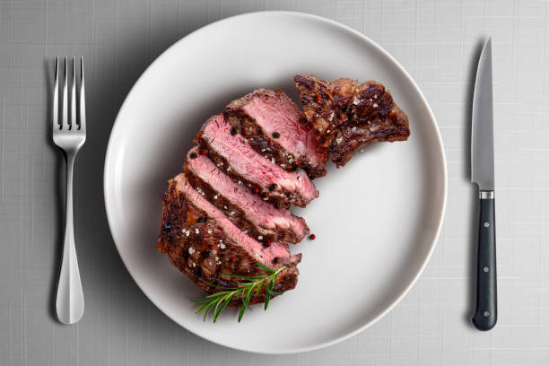 istock Grilled Beef Steak Sliced ​​on White Plate 2185259617
