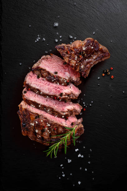 istock Grilled beef steak sliced on black stone 2185259777