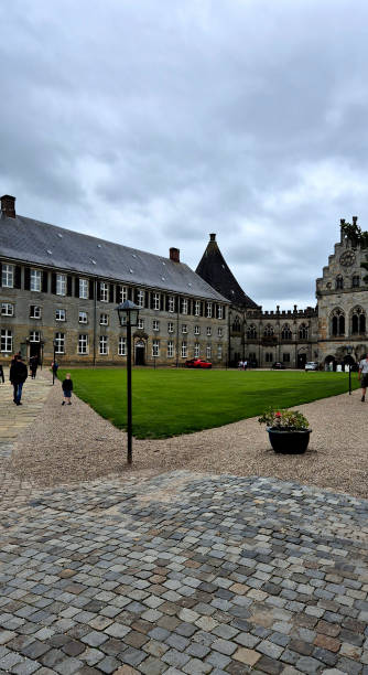 istock a beautiful historical building with a green lawn. 2185260008