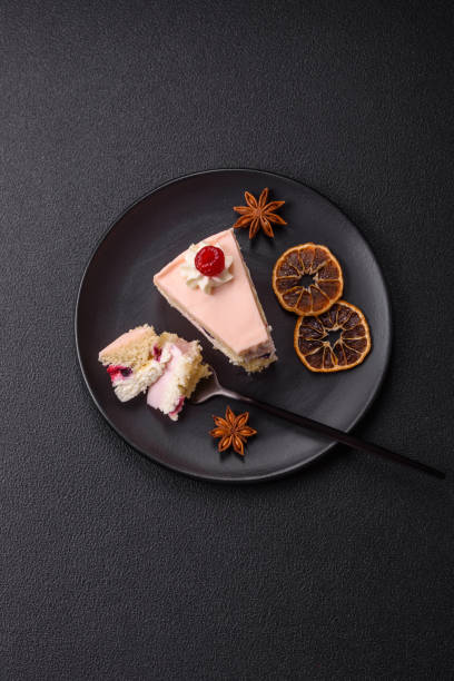 istock Piece of sweet cake with pink cream with raspberry flavor, with shortbread, cheesecake 2185260077