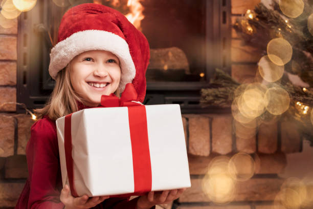 istock Christmas Kid Having fun with Christmas Gift Box 2185260261