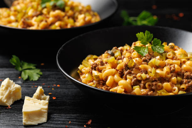 istock Cheeseburger Pasta with beef, melted cheese, gherkins and pasta 2185263492