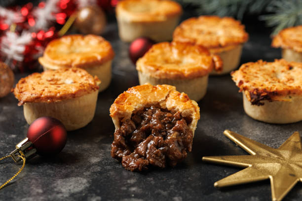 istock Christmas steak mini pie with decoration, gifts, green tree branch 2185263669