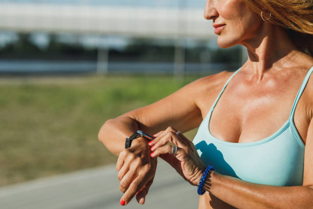 istock Woman Looking On Smart Watch After Training Outdoor 2185266476