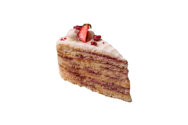 Piece of sweet layer cake with white cream, raspberries and strawberries